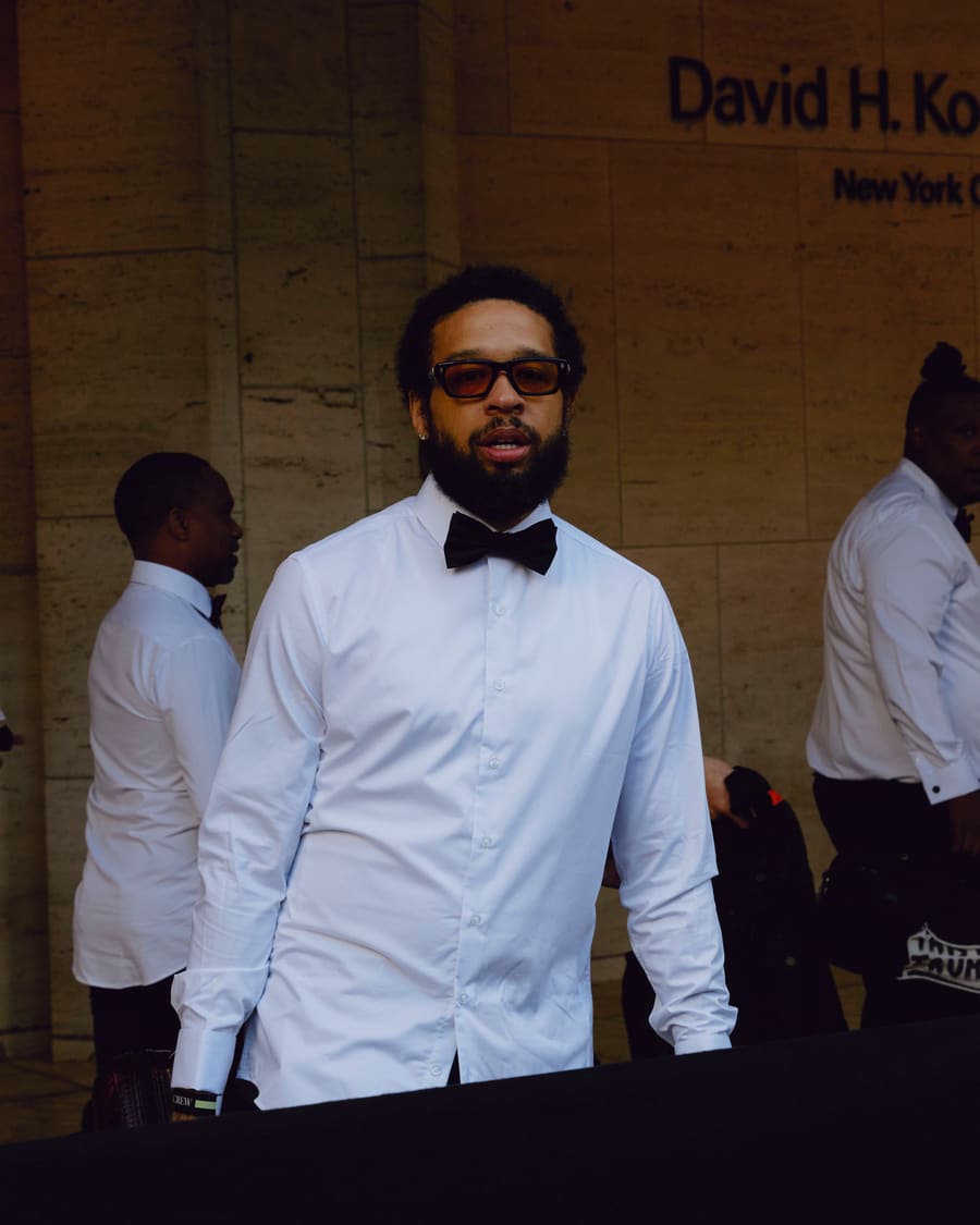 Kenneth Whalum in a white shirt and black bow tie outside the David H. Koch Theater at Lincoln Center
